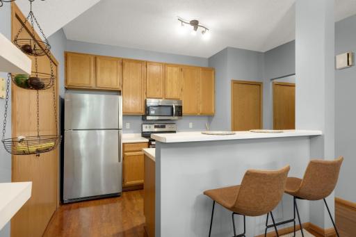 Open kitchen with eat up breakfast bar.