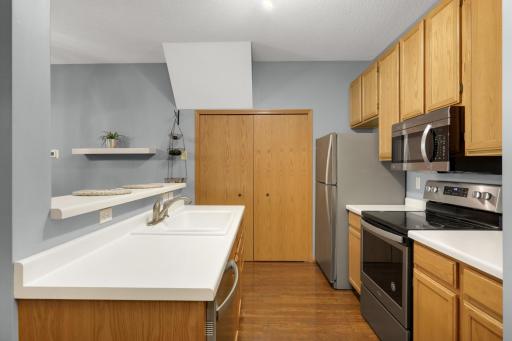 Kitchen features all stainless steel appliances.
