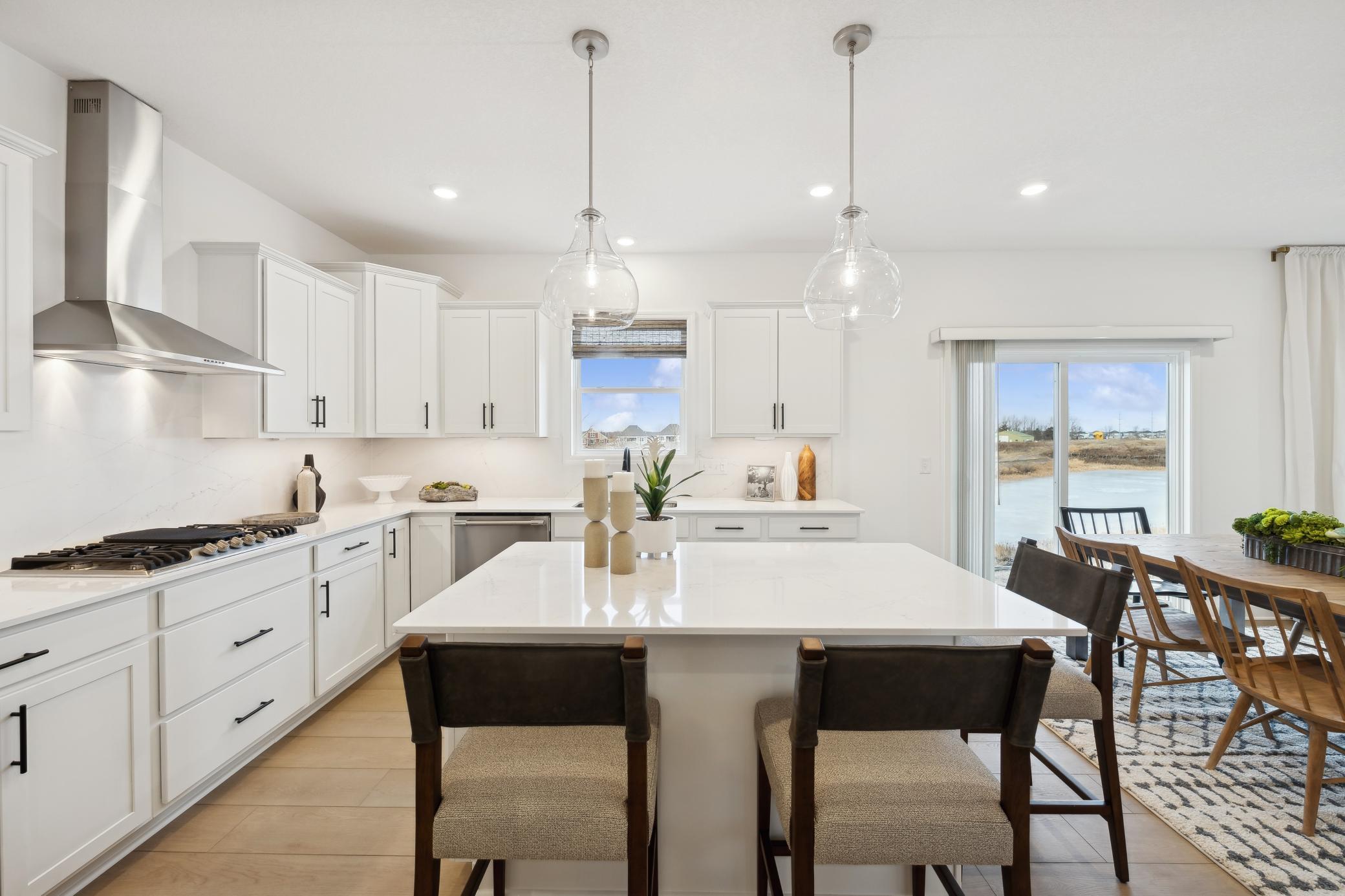 (Photo of a similar home, features will vary) Enjoy island seating for quick snacks or informal dining for a crowd.
