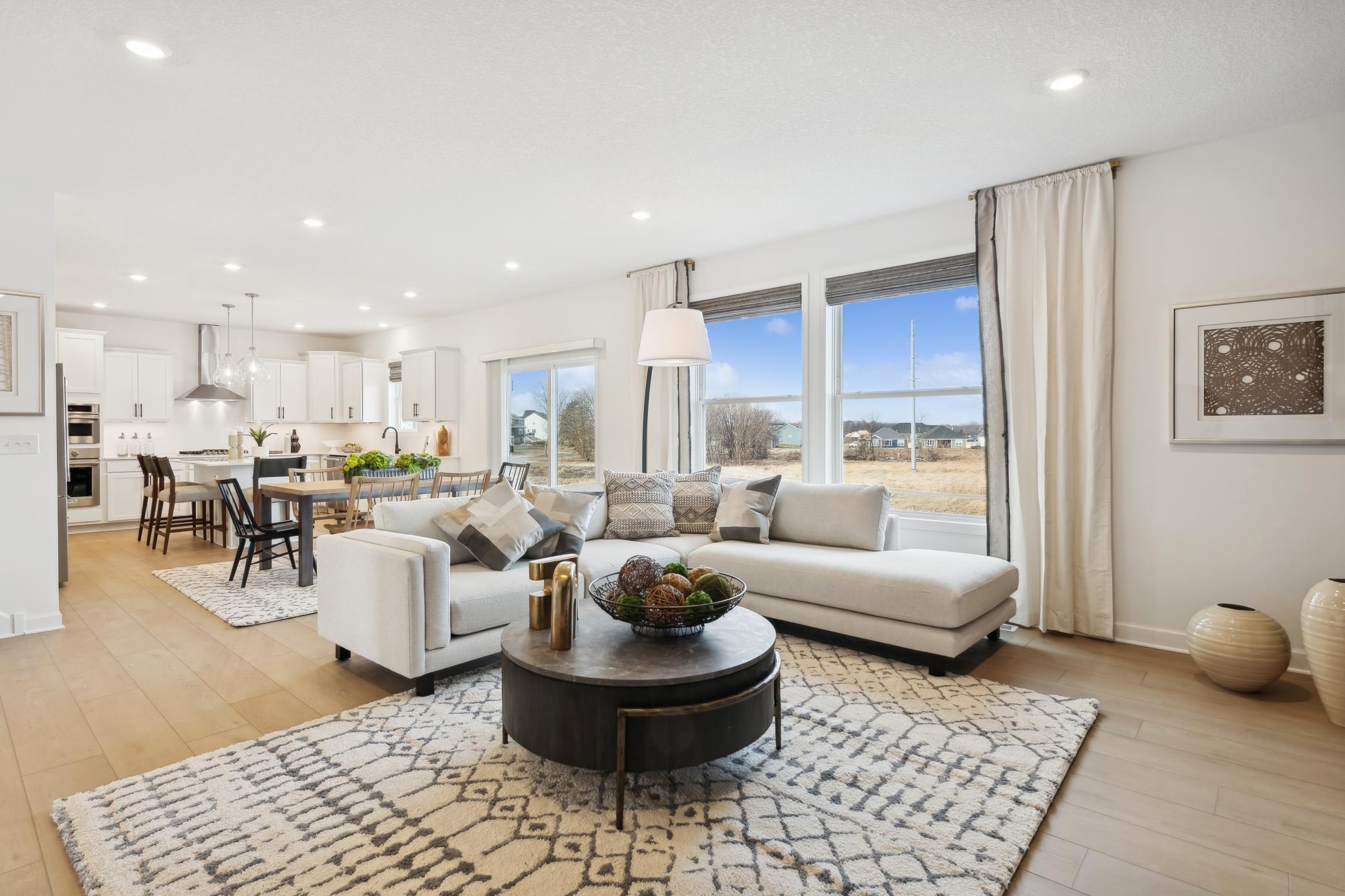 (Photo of a similar home, features will vary) The Great Room features large windows for ample natural light and is the perfect place for gathering with friends and family.