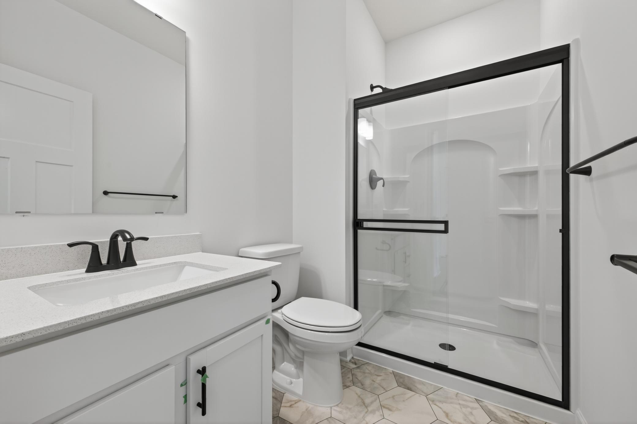(Photo of a similar home, features will vary) Connected to the main level bedroom is a 3/4 bath!