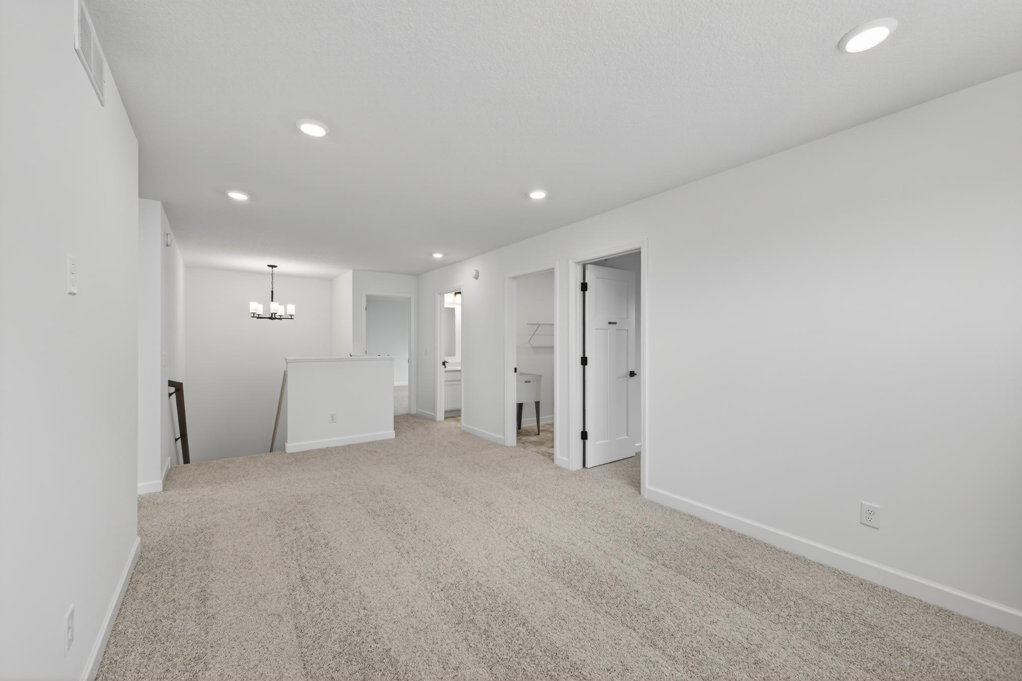 (Photo of a similar home, features will vary) Well-lit upper level loft doubles as a second family room.