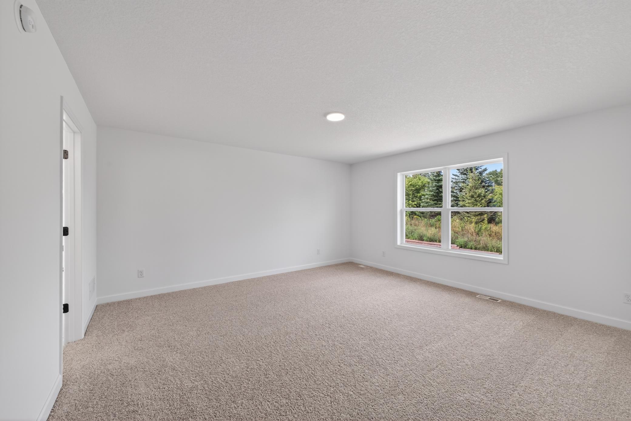 (Photo of a similar home, features will vary) Find your retreat in this stunning owner's suite. Enjoy the exclusivity of a private bath and huge walk-in closet.