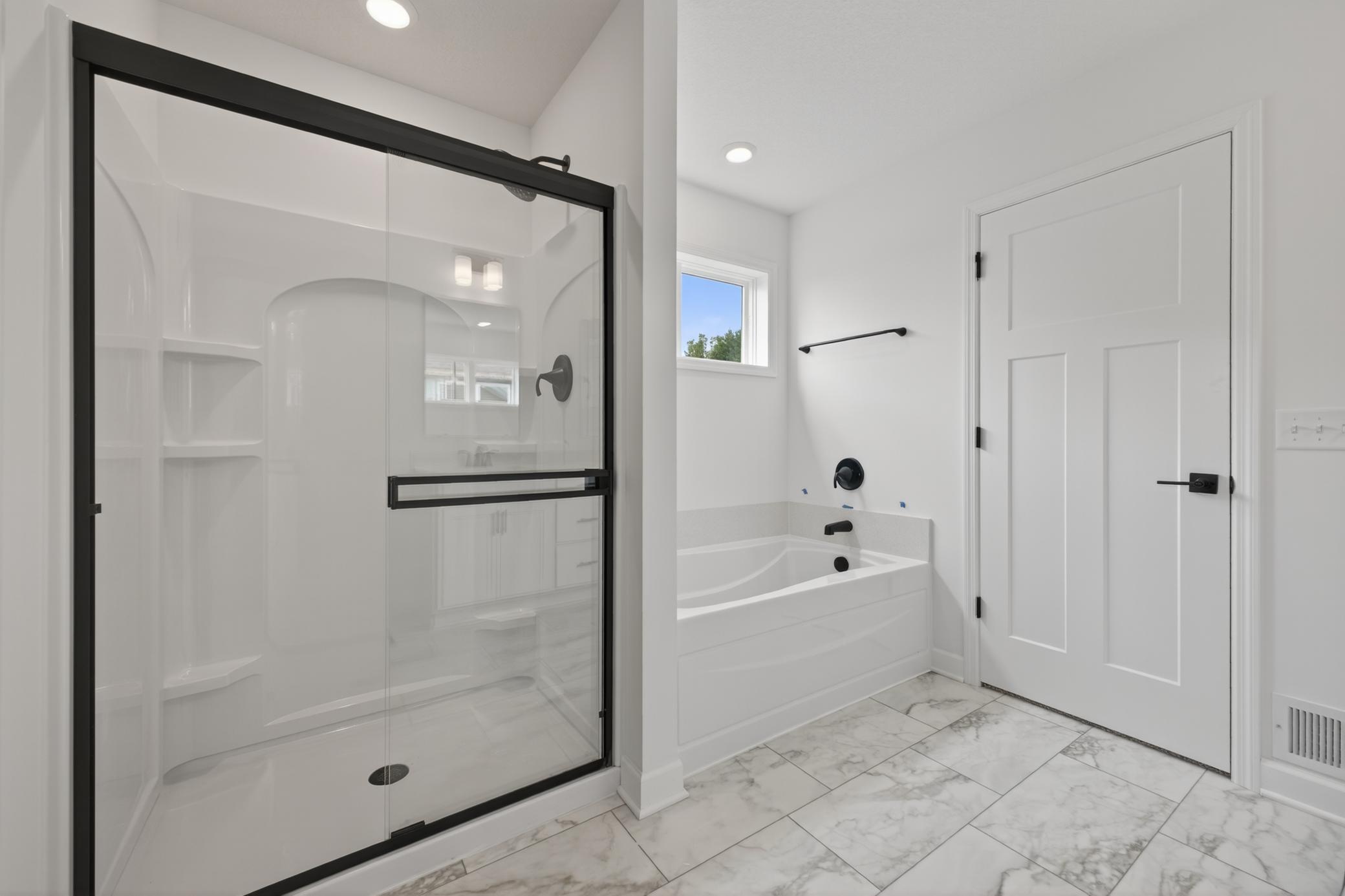 (Photo of a similar home, features will vary) Both tub and separate shower are included in the owners bath.
