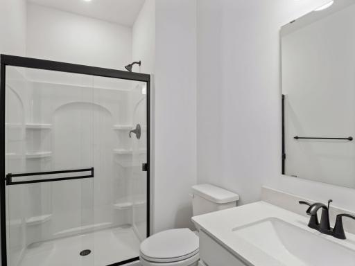 Conveniently placed near the Great Room, this bathroom is conveniently trucked away with privacy in mind.