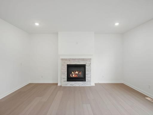 The Great Room features large windows for ample natural light and is the perfect place for gathering with friends and family.