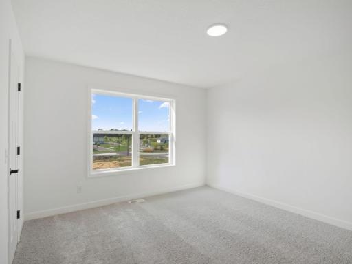 All upper-level bedrooms are equipped with a walk-in closet.jpg