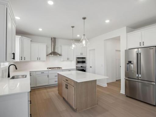 The kitchen has ease-of-access to the mudroom and flows seamlessly into the dining room