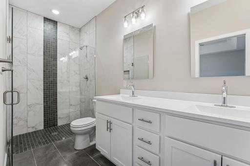 Ensuite with stunning walk-in shower and double sink vanity!.jpg