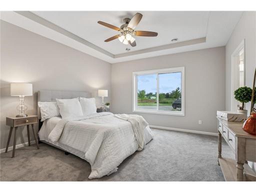 Inviting main bedroom with tray ceilings..jpeg