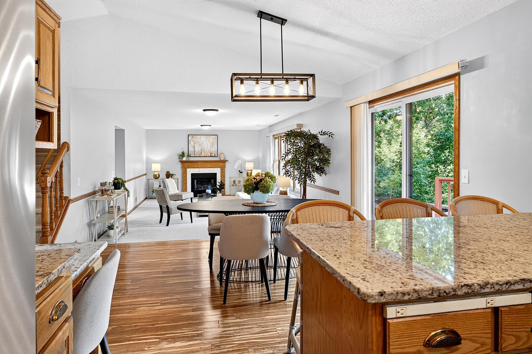 Kitchen and dining area is open to spacious sunken living room.