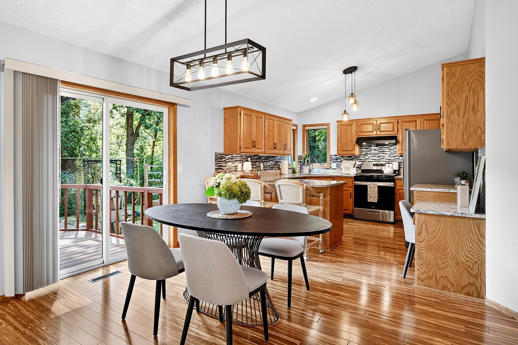 Open main level features gorgeous Brazilian hardwood floors, vaulted ceilings, light-filled kitchen and dining area, and immediate access to deck and private backyard.