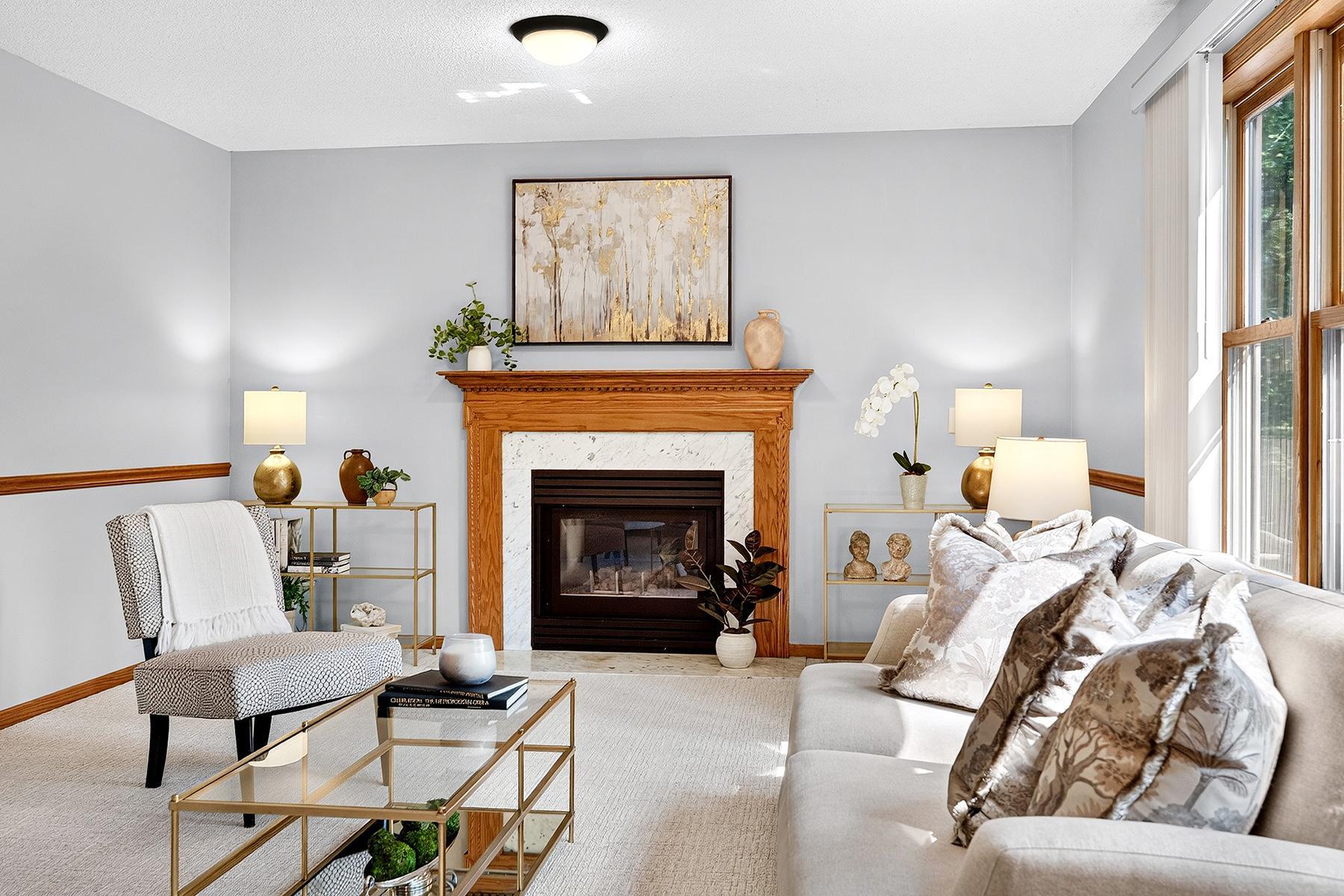 Gas fireplace with stone hearth and natural wood mantel.