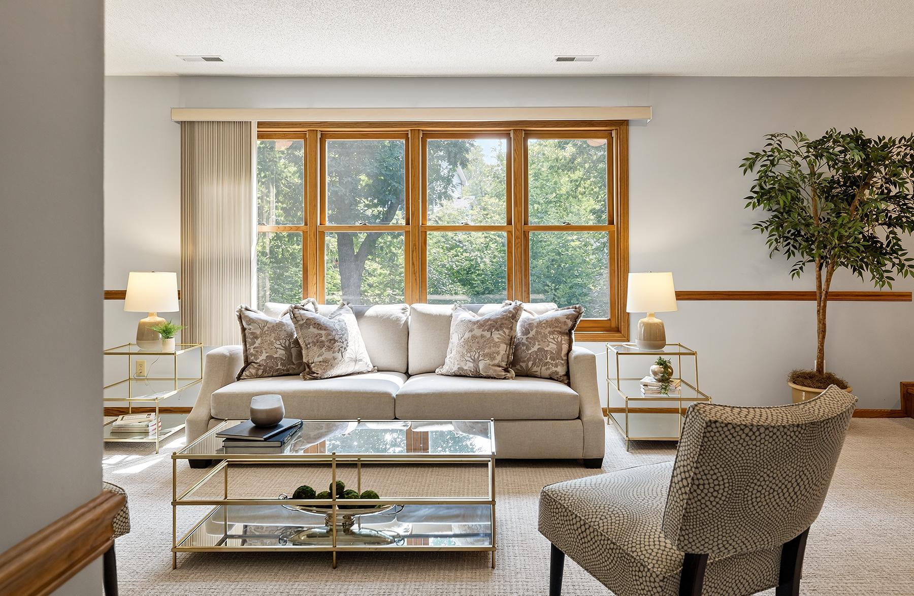South-facing windows frame the trees and greenery.