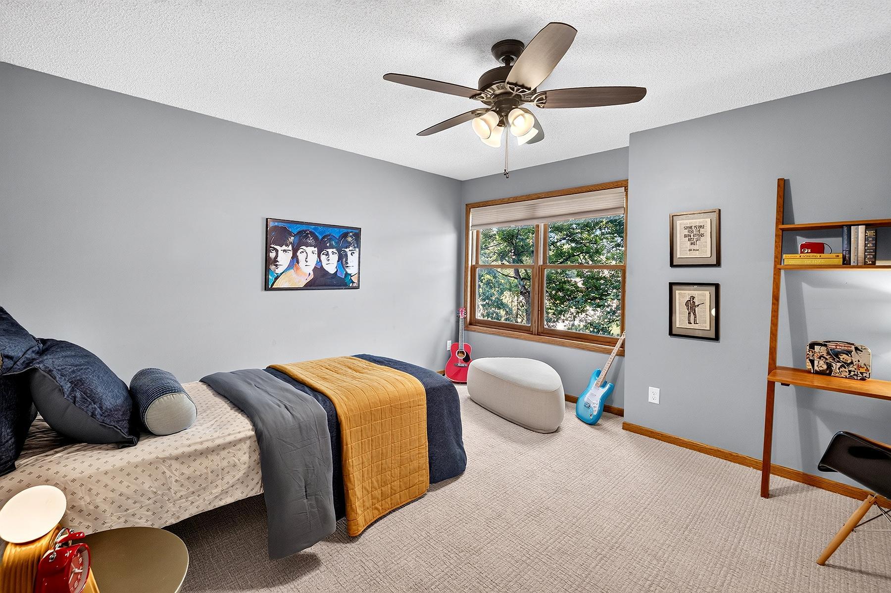 Second level bedroom across from primary bedroom.