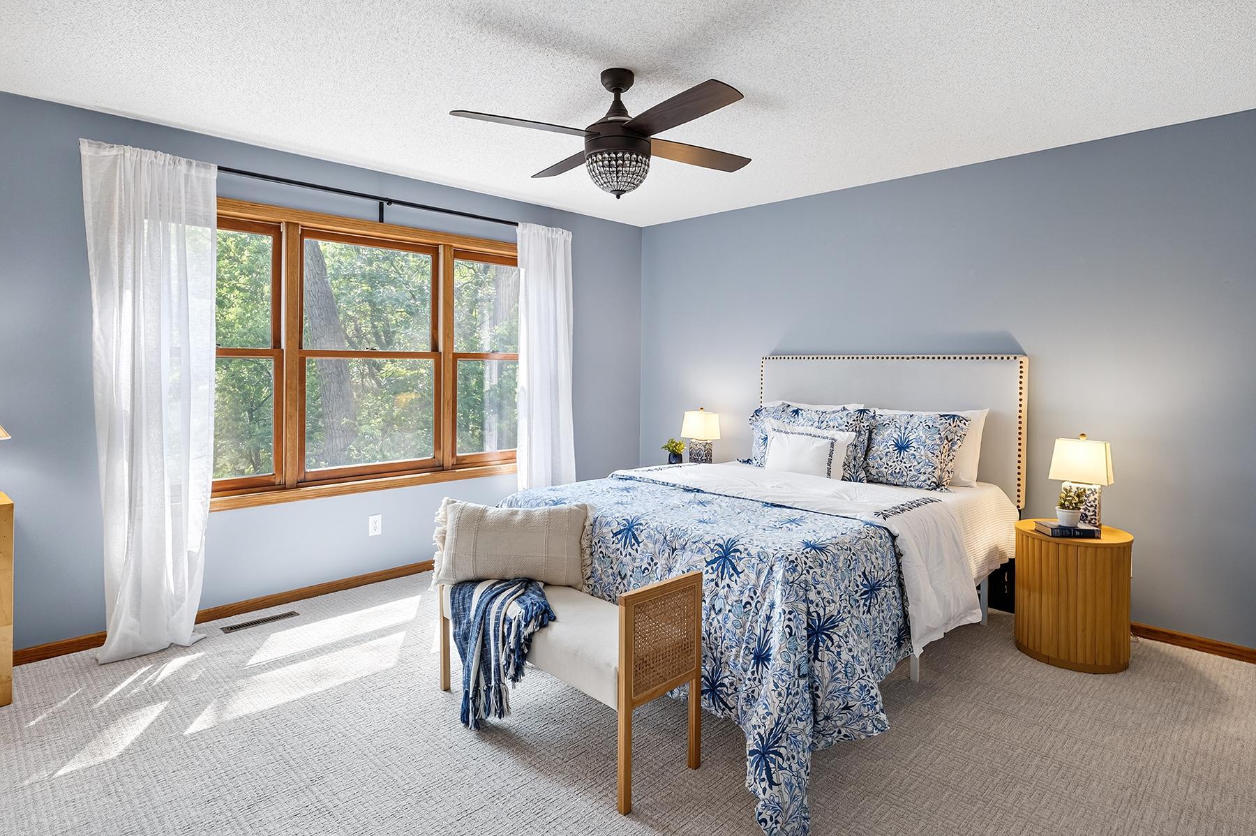 Large primary bedroom with windows overlooking backyard. All new carpet!