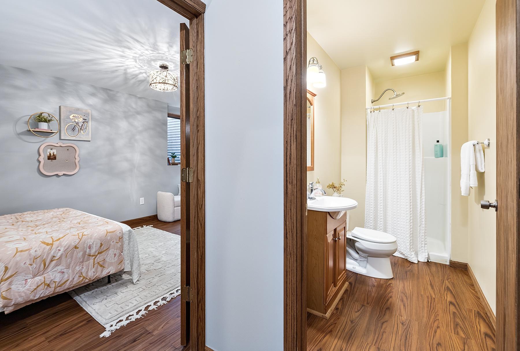 Lower level bedroom and adjacent bathroom with shower. Great guest suite or teenage space.