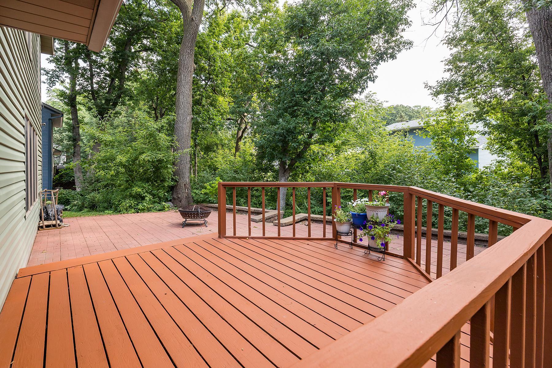 Huge deck and quaint brick paver patio in back, directly off dining area and kitchen.