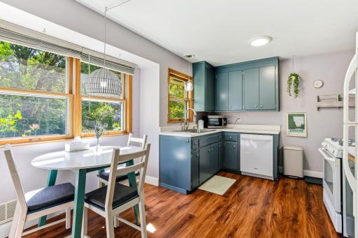 Beautiful updated kitchen with modern appliances, newer LVP flooring and light fixtures.