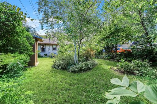 Ultra private, yard full of beautifully maintained perennials that bloom at different times of the year.