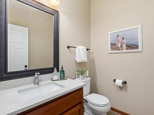 Powder room off back entry and garage