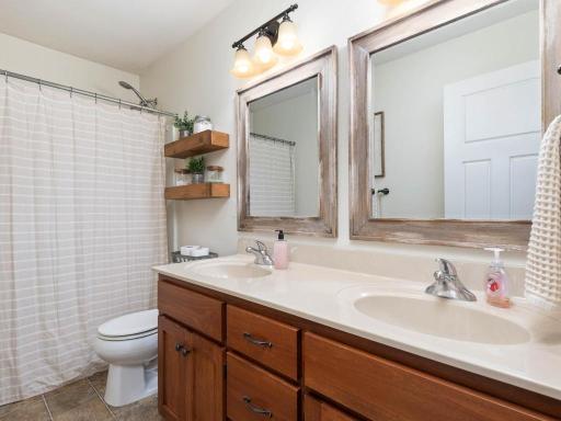 Upper level full bath with dual sinks