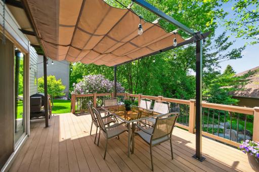 Spacious maintainence-free deck with retractable sunshade