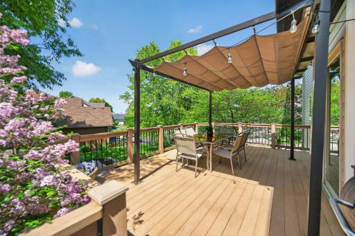 Spacious maintainence-free deck with retractable sunshade