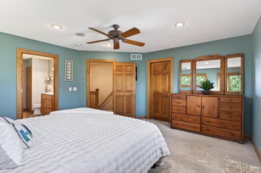Serene primary suite with walk-in closet and private ensuite bathroom