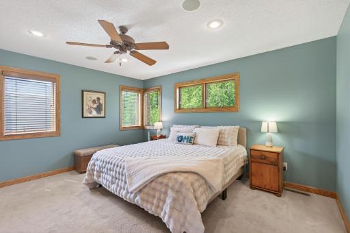 Serene primary suite with walk-in closet and private ensuite bathroom