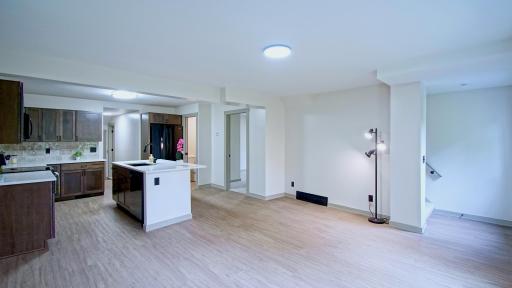New center island in kitchen featuring quart countertops and soft close cabinetry.