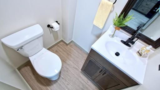 New 1/2 bath on main level featuring new vanity and LVP flooring.