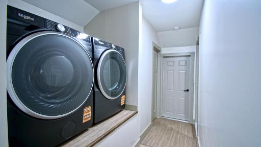 Brand new washer and dryer on main level! Doorway to the left leads to the basement. Back entry door is straight ahead. Additional bedroom to the right.