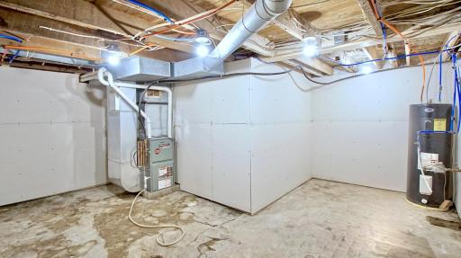 The basement of home. Electric water heater and gas forced air furnace. 100 amp electric service.