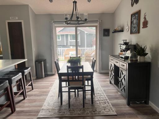 Sun filled dining area overlooks the backyard