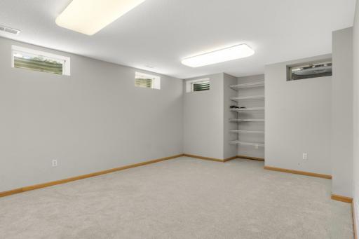 New carpet in this bonus room that was used as an office. Adding an egress window makes this bedroom #5. How would you use this space?