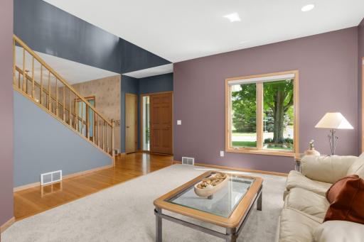 Gleaming hardwood floors and two story foyer welcome you into this well loved home. Open living area is bathed in natural light with East and South facing windows.