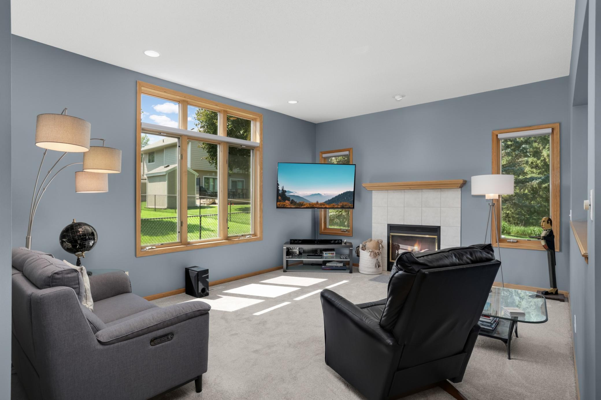 The sunken family room is spacious but cozy thanks to the gas fireplace and large south and west facing windows.