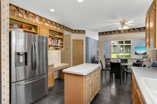 Built in desk and large pantry allow for great storage and organization. Look at the great flow into the family room from the kitchen.