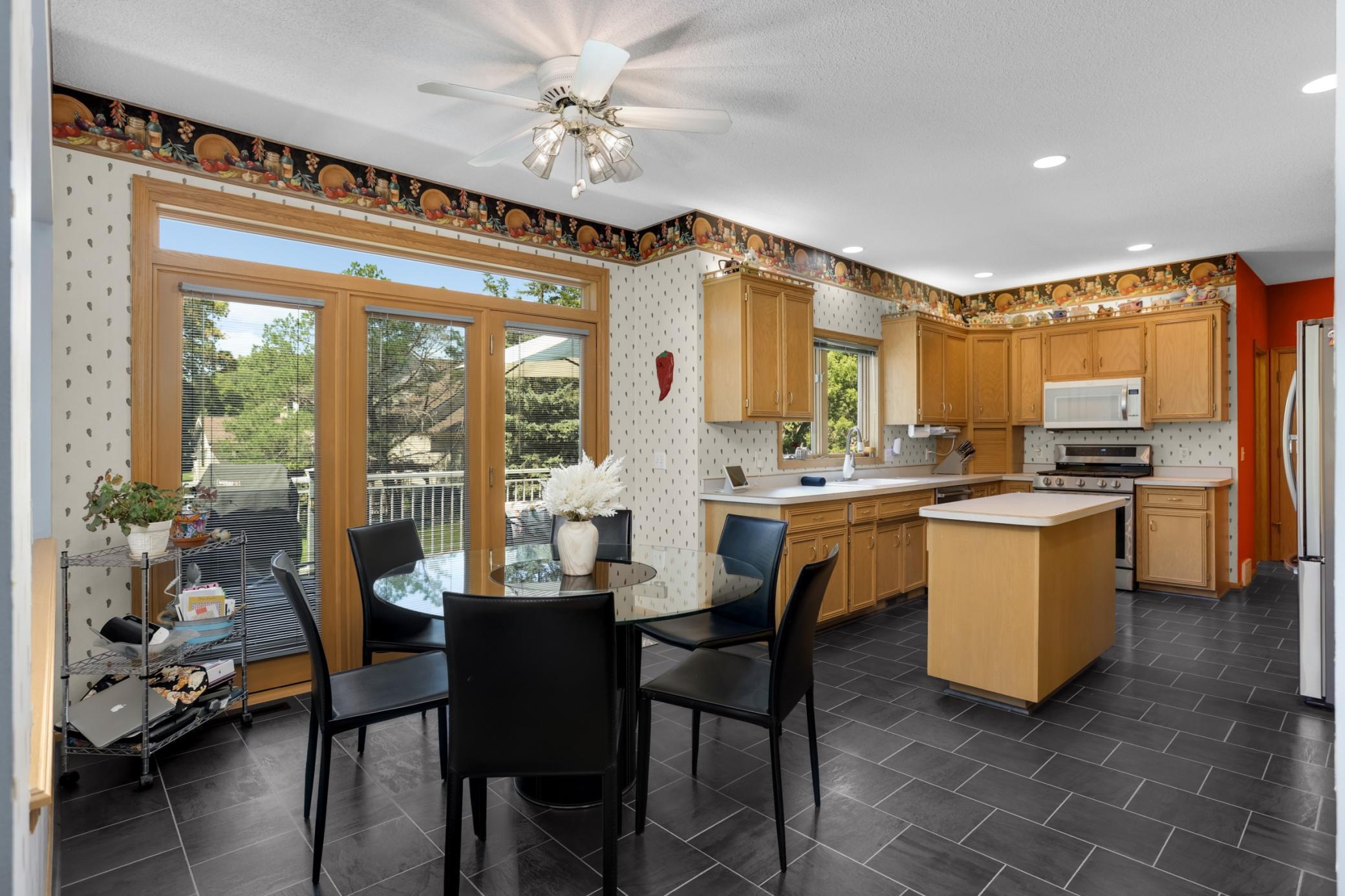 The kitchen is spacious and has an abundance of cabinet storage. Updating flooring as well.