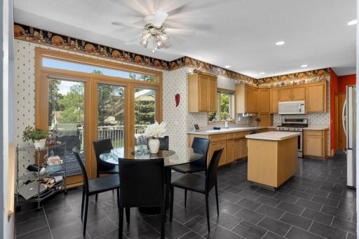 The kitchen is spacious and has an abundance of cabinet storage. Updating flooring as well.