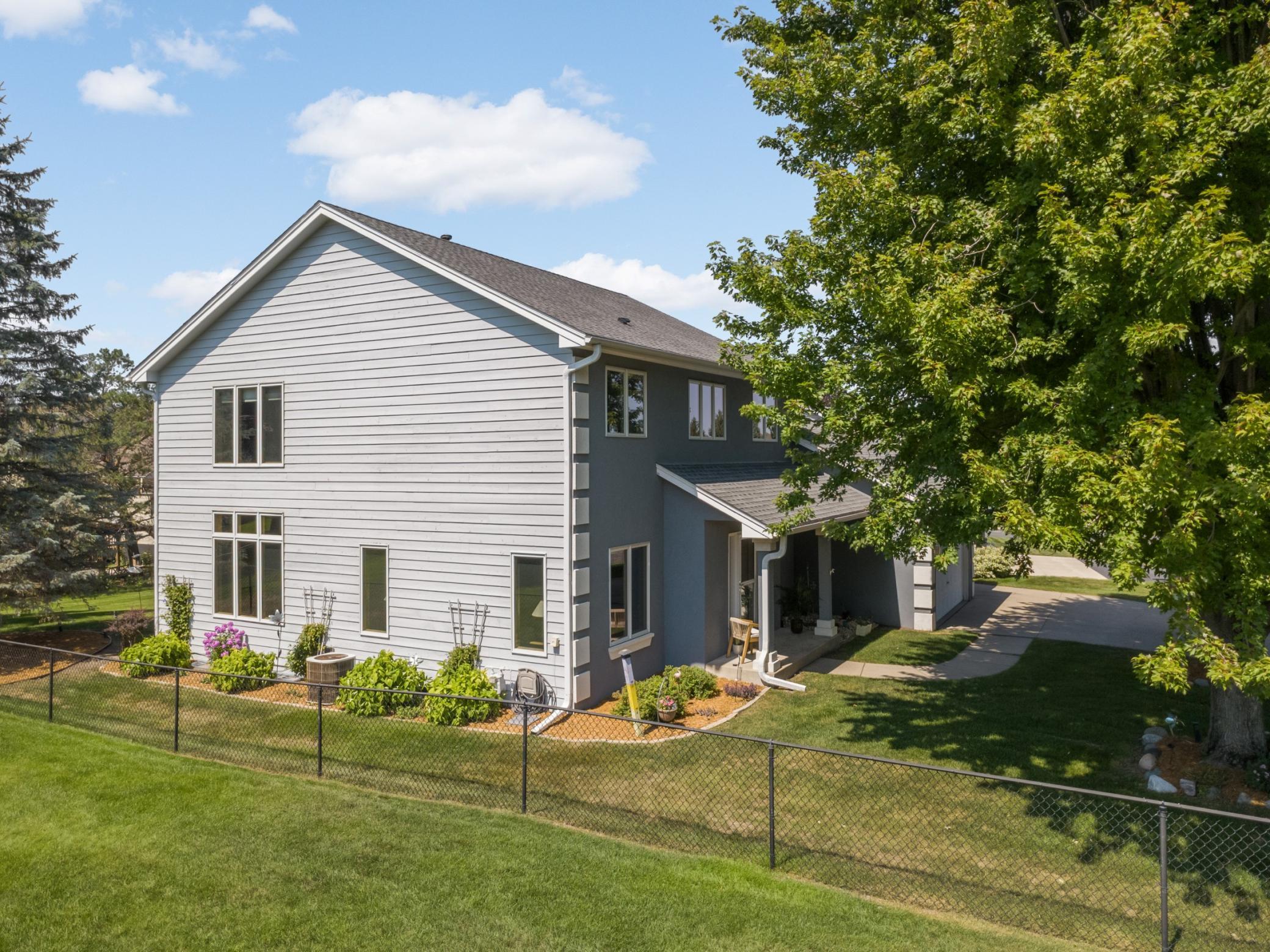 Refreshed landscaping and oversized windows add to the appeal of this home.