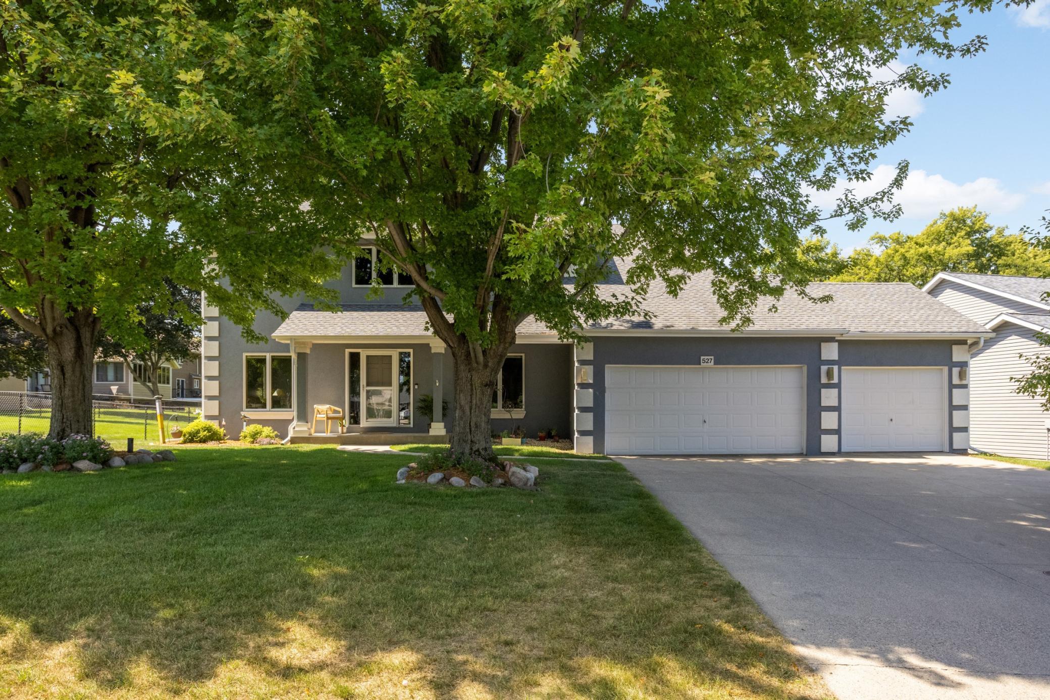 Note the fantastic concrete driveway. The front stucco has been recently replaced with the Dryvit stucco system for durability and moisture prevention. Gutters are protected by leaf guard for easy maintenance.