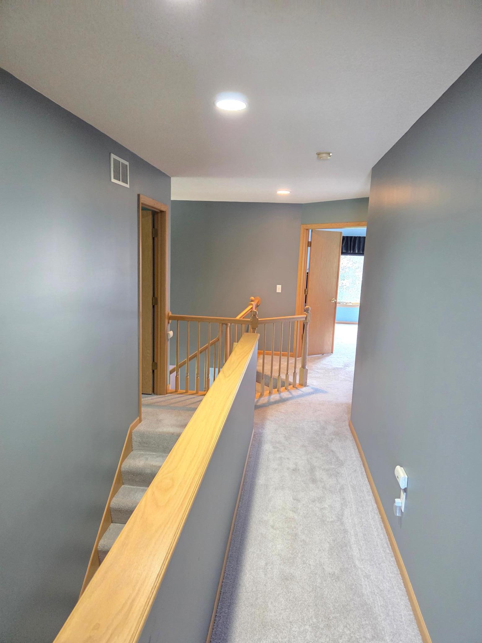 Second "hidden" staircase conveniently leads directly into the kitchen and laundry area
