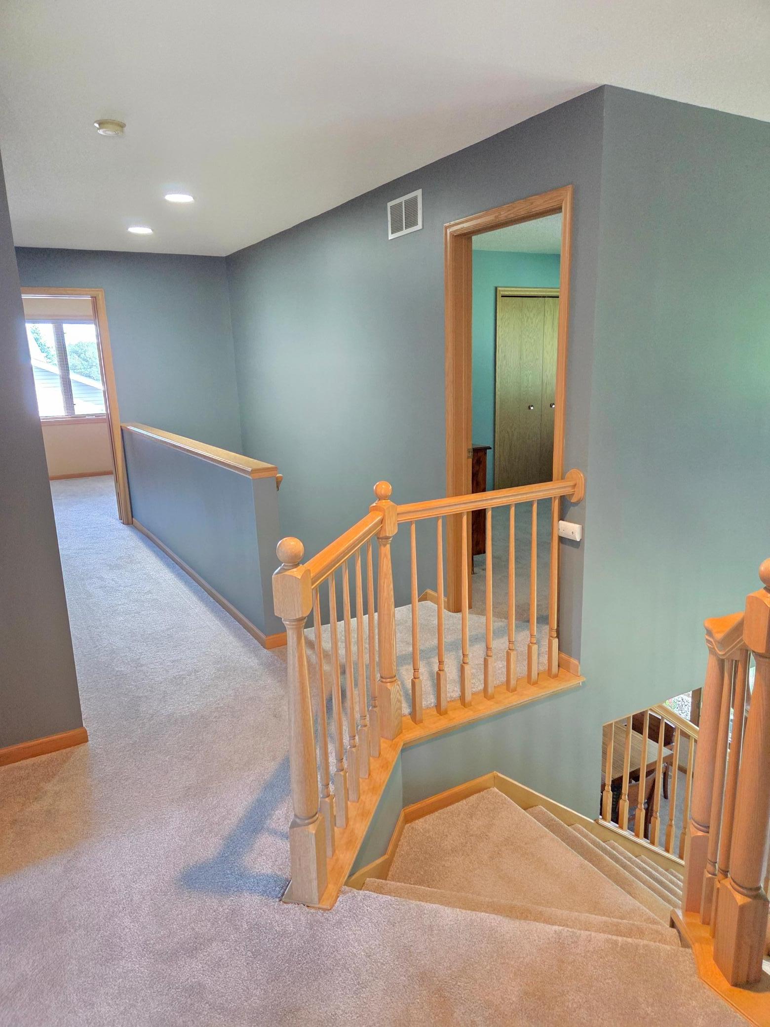Unique double staircase connecting the main and upper living areas