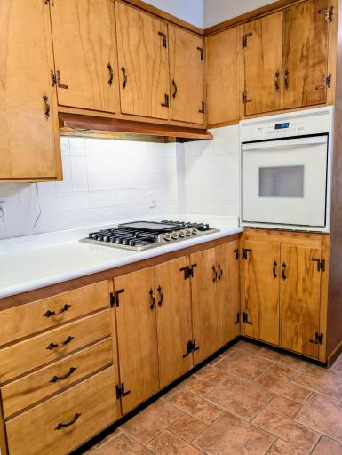 Gas cook top, copper hood vent, wall oven