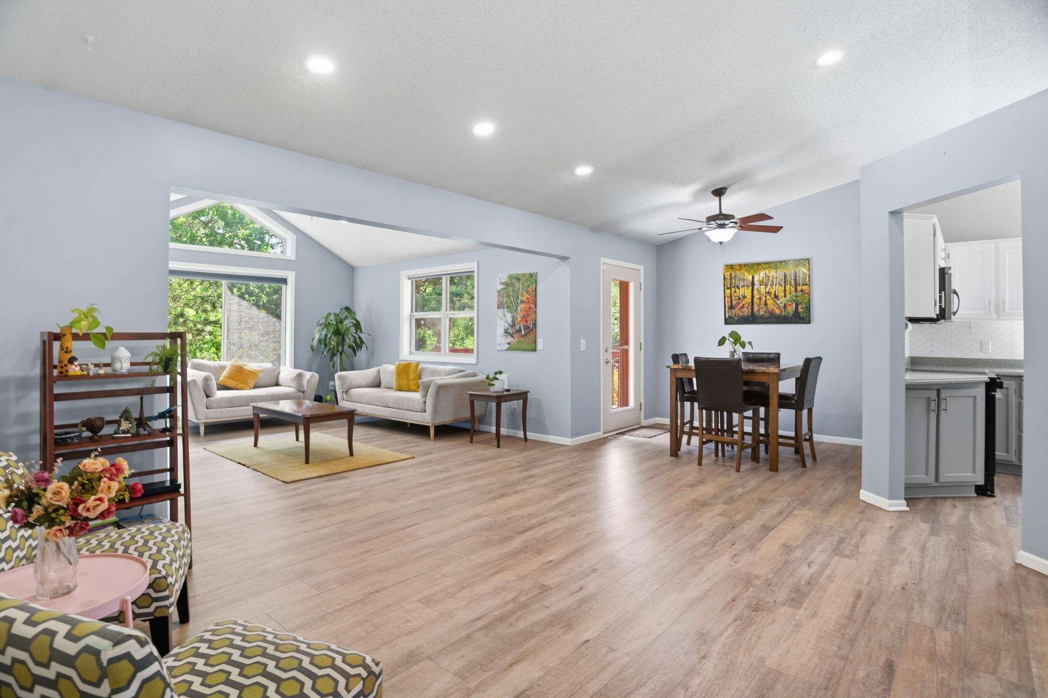 The open-concept layout connects the living room, dining area, and kitchen for effortless gatherings.