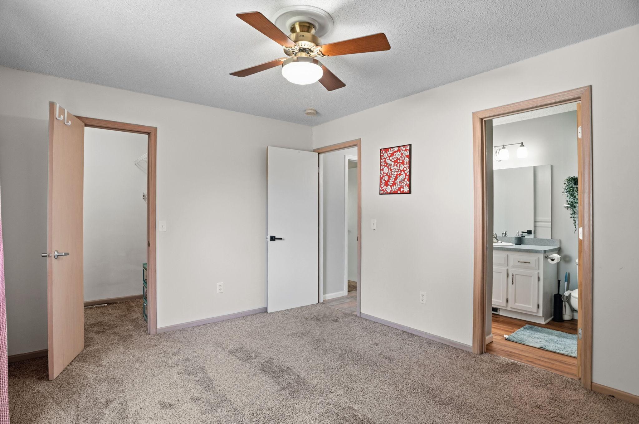 The primary suite offers a private bathroom and a generous walk-in closet.