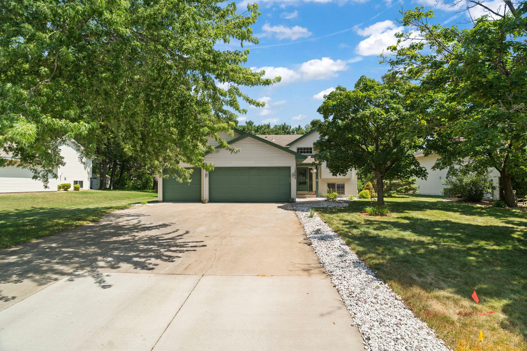 A spacious three-car garage provides plenty of room for vehicles, storage, and everyday convenience.