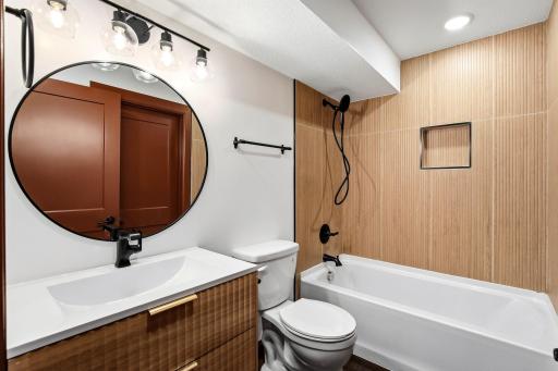 Designed with both style and functionality in mind, the upstairs bathroom features modern finishes, quality craftsmanship, and a fresh, timeless design that complements the home's extensive renovation.